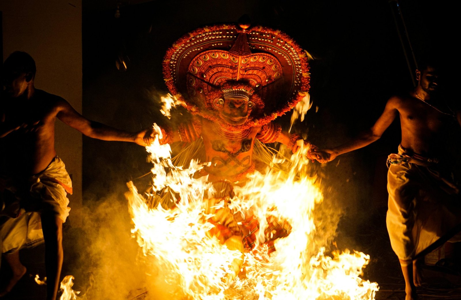 Theyyam performance in Kannur temple courtyard
